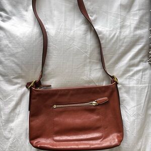 Vintage Coach Crossbody with outside pocket.